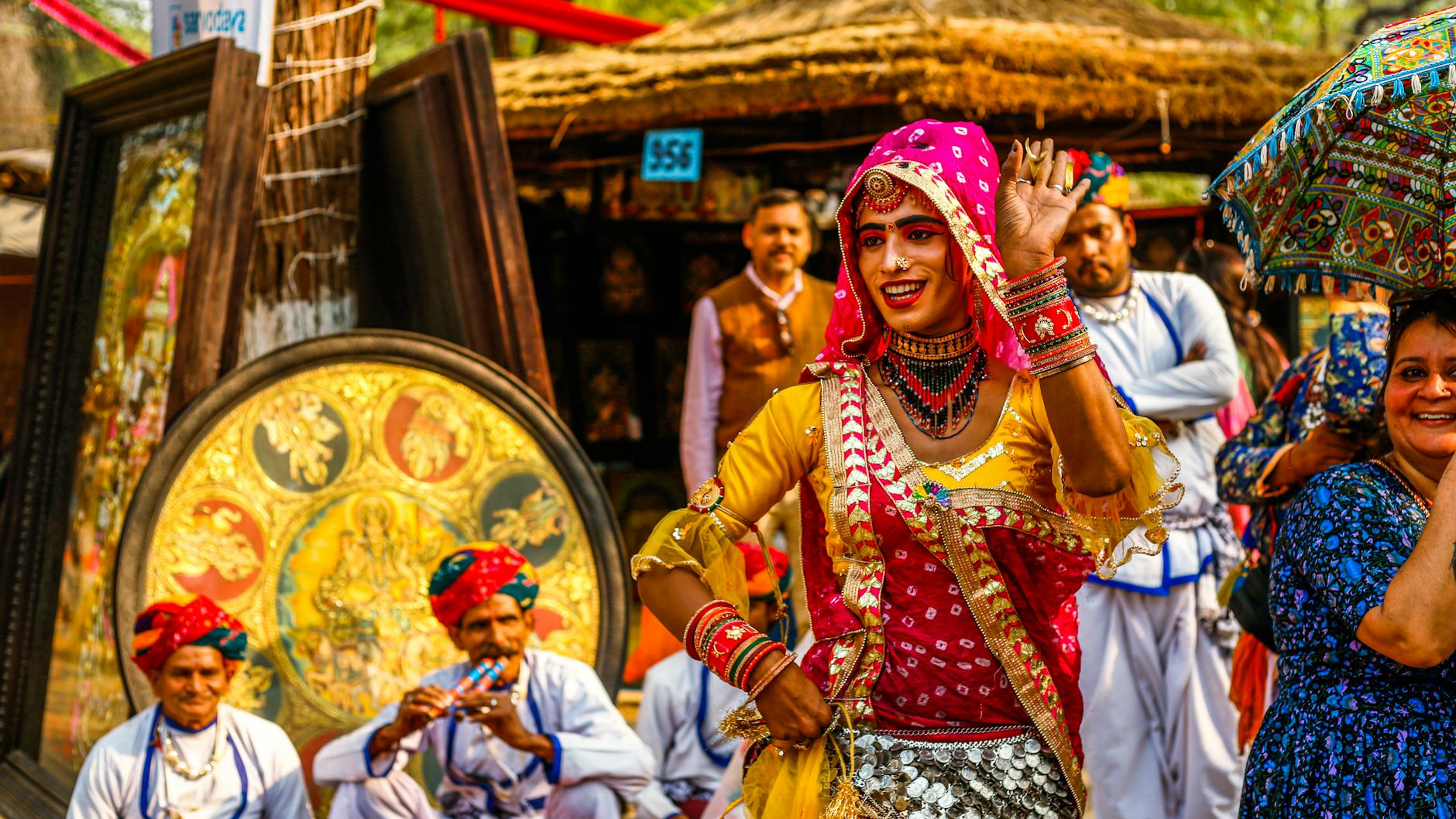 a woman in traditional indian clothing dancing
