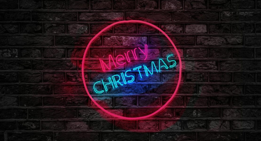 turned on red and blue merry christmas neon sign